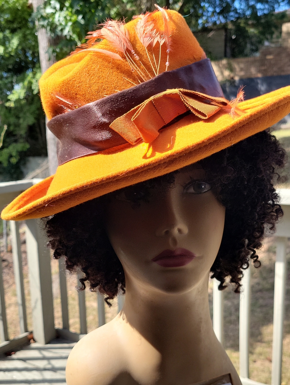 Vibrant Orange Felt Fedora with Brown Band and Feather Accent